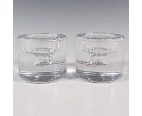 A set of 2 clear votive candle holders with a hand painted silver rings on the bottoms. Orrefors stickered. Items have its or