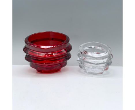 A pair of candle holders, artistically sculpted into an abstract form. Marked Orrefors. Dimensions of the largest item: 6.25"