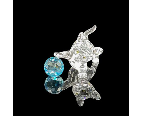 Dazzling clear crystal figural with amber eyes playing with blue crystal ball. Swarovski backstamp. 7619 000 011. This item h