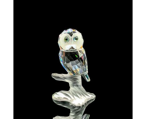 Sparkling clear faceted crystal owl figure with green/blue eyes perched on a frosted branch base. Part of the Up in the Trees