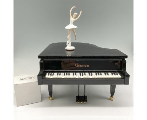 Beautiful replica of Grand Piano that plays music with adapter or batteries and has a dancing magnetic ballerina with moving 