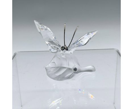 Part of the In The Secret Garden group. A clear winged insect, with metal antennae, on a frosted leaf. Swarovski marked. This