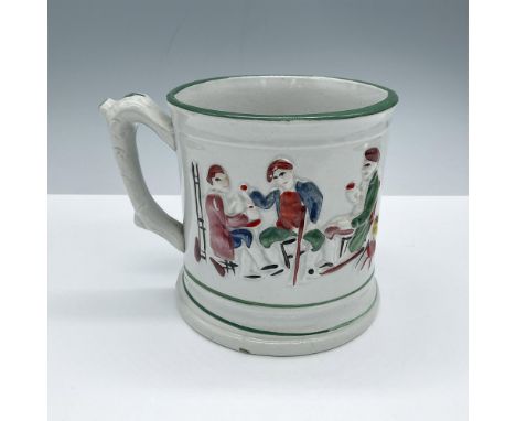 Hand painted ceramic trick mug. Ornately decorated with a tavern scene in rich colors, intricate green details and a brown fr