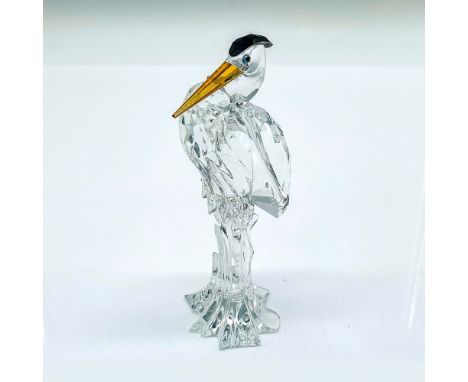 Multifaceted clear crystal heron with gold beak and black top of head. Part of the Feathered Friends Collection. Swarovski et