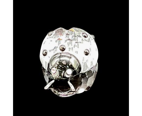 Clear body with black facets on back, black face with clear crystal eyes, metal antennae. Swarovski backstamp. 7604 000 001. 