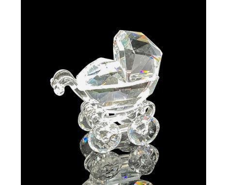 Clear crystal detail representation of a buggy. Swarovski backstamp. 7473 000 005. This item has its original box: 3"H x 4"di