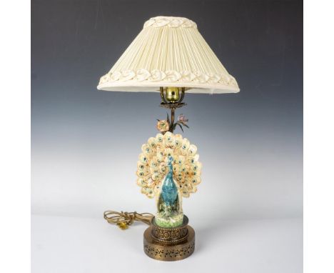 Chinoiserie style Majolica peacock rose table boudoir lamp with filigree base. The fanned tail peacock stands on the intricat
