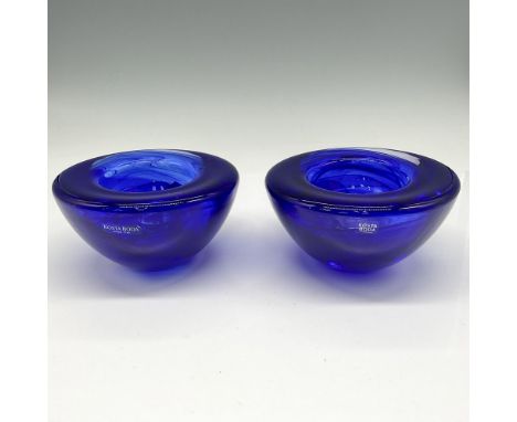 Cobalt blue coloration gives these holders an elegant, dramatic presence when lit. Kosta Boda mark. One item has its original