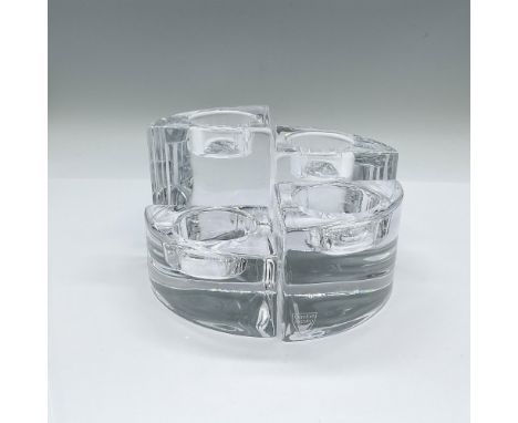 A set of 4 clear votive candle holders in various sized wedge pieces. Together the pieces form a circle. Orrefors marked. Tal
