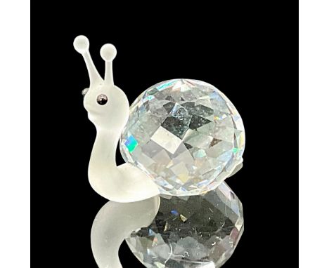 This Swarovski Silver Crystal snail comes with a clear faceted shell and a frosted head with black eyes. This item has its or