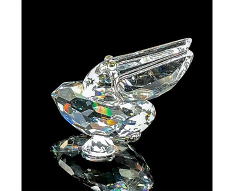 Clear faceted figure of a water bird with blue-green eyes. Part of the Feathered Friends collection. Swarovski etched mark. T