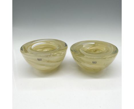 Lovely, swirled beige into clear glass giving it a slight appearance of yellow. Kosta Boda mark. 7060612. One item has its or