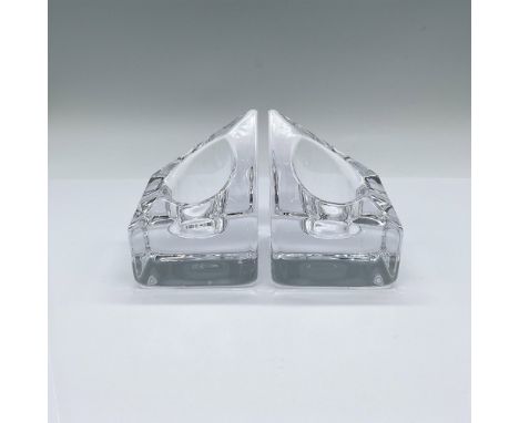 A set of 2 clear votive candle holders in a slanted geometric shape. Orrefors marked on the undersides. Issued: Late 20th cen