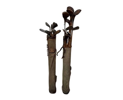 Two canvas and leather bags of c.1900 and vintage Golf Clubs, hickory and other shafts, wood drivers by D &amp; W Auchterloni