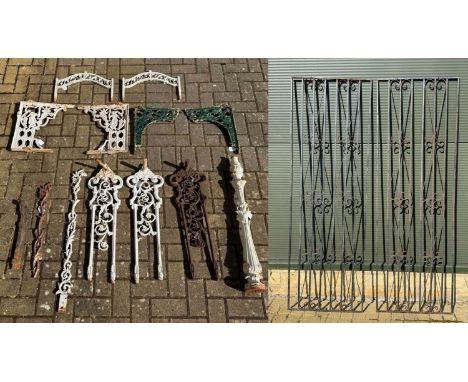 A quantity of ironwork to include cast brackets part of a mid 19th century balustrade, together with two metal panels or gril