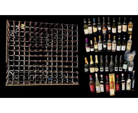A large quantity of wines and spirits in a free standing wine rack, built to hold 143 bottles, height 112cm, width 131cm, bot