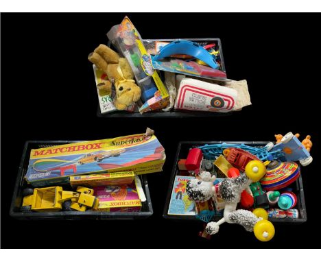 A quantity of vintage mid to late 20th century children's toys, Kitsch poodle pull-along toy on wheels, a yellow diecast Tonk