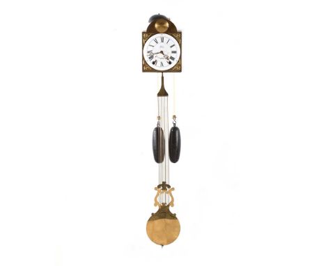 BRASS DOUBLE WEIGHT WALL CLOCK WITH AN ENGRAVED MOON TO TOP AND A CIRCULAR ENAMEL DIAL OF 6½ INCHES. HEIGHT: 7 INCHES.WIDTH: 