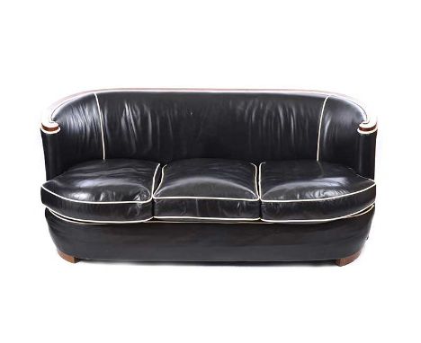 ART DECO BLACK LEATHER SETTEE WITH CREAM LEATHER PIPING AND WALNUT FRAME.HEIGHT: 29 INCHES.WIDTH: 67 INCHES.DEPTH: 29 INCHES.