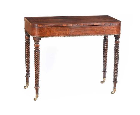 REGENCY ROSEWOOD TURN OVER LEAF CARD TABLE WITH BRASS BEADING.RAISED ON TWIST LEGS WITH BRASS CASTORS.HEIGHT: 30 INCHES.WIDTH