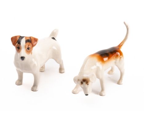 Two Beswick ceramic figures of dogs. Comprising a Hound and a Terrier.

