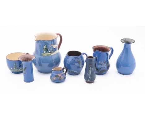 A collection of Watcombe studio pottery. Comprising a teapot, jugs, a fruit bowl and plates etc.