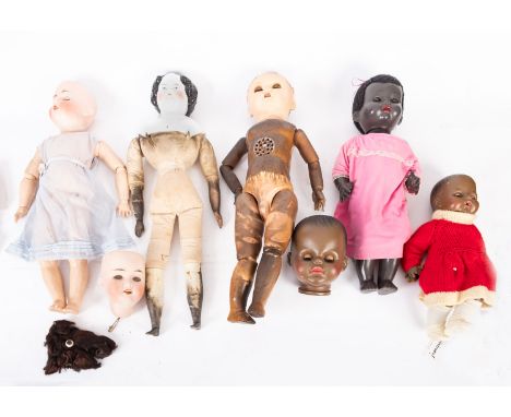 A mixed collection of bisque and porcelain head dolls. Together with a small selection of doll accessories etc.