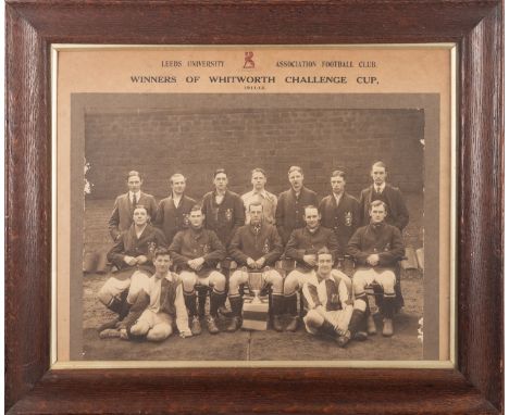 A photograph of the Leeds University Football team dated 1911-12. Showing the players placed around a silver trophy the text 
