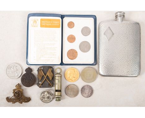 A group of mixed collectables. Comprising a pewter hip flask, Metropolitan Police whistle, badges noting Boy Scouts and a ran