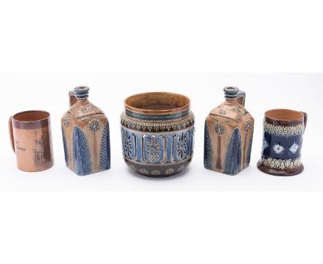 Two Bailey of Fulham stoneware decanters 'Gin' and 'Brandy'. Having floral decoration and blue rim, 21cm high, together with 