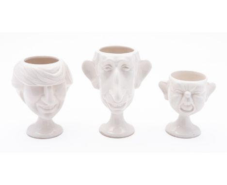 Three Fluck & Law Carlton Ware egg cups modelled as Prince Charles, Lady Di and Prince William, in the white.