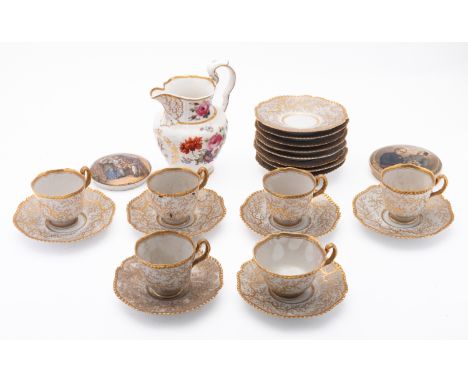 A Regency part tea service with moss fibre decoration. Decorated in gold on a white ground comprising six cups and 14 saucers