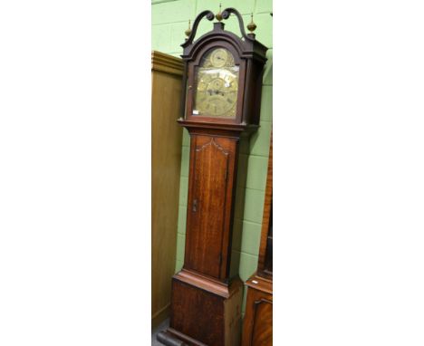 An oak eight day longcase clock, arched brass dial inscribed R Henderson, Scarborough, later case