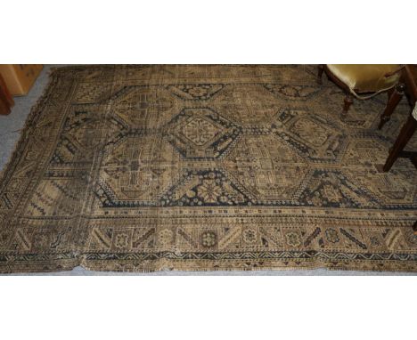 Khamseh carpet, central panel with ten medallions decorated with hooked geometric design within conforming narrow borders, 30