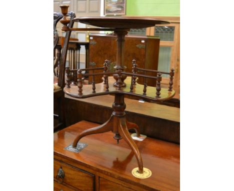 A Victorian burr walnut circular occasional table with revolving candle sconce and a similar gallery triform shelf, labelled 