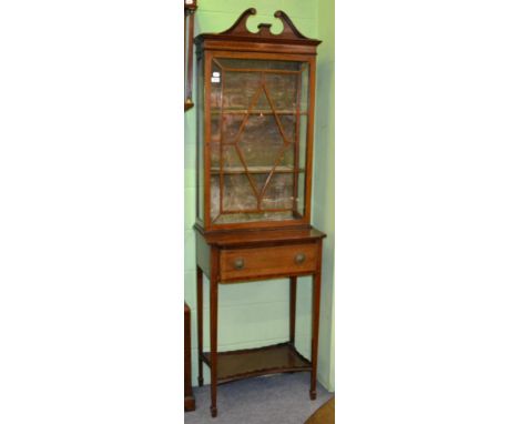 A cross banded and inlaid mahogany curio cabinet on stand fitted with a lined drawer and the legs joined by a waisted, galler