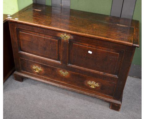 An 18th century oak mule chest, hinged lid, double-panel over long drawer