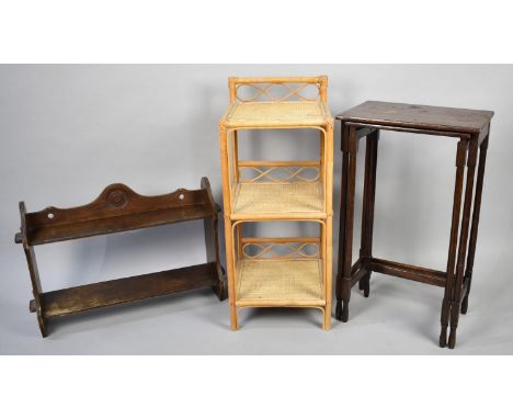An Early/Mid 20th Century Oak Wall Shelf, 57cms Wide together with a Nest of Two Tables and a Bamboo and Wicker Three Tier St