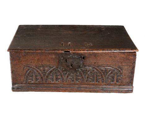 A Charles II oak Bible box, third quarter 17th century, of rectangular form, the hinged cover inscribed with the initials H B