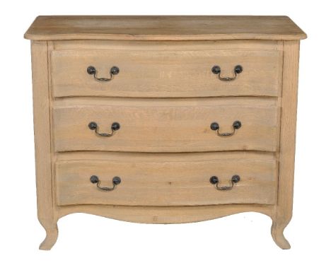 An oak commode in Continental 18th century style, of recent manufacture, of serpentine outline, 91cm high, 110cm wide, 51cm d
