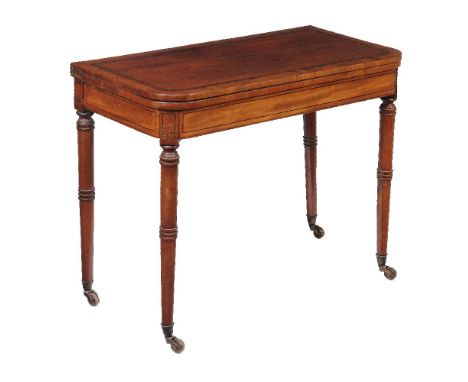 ϒ A Regency mahogany and ebony inlaid card table, circa 1815, on ring turned legs, 74cm high, 90cm wide, 45cm deep ϒ Indicate