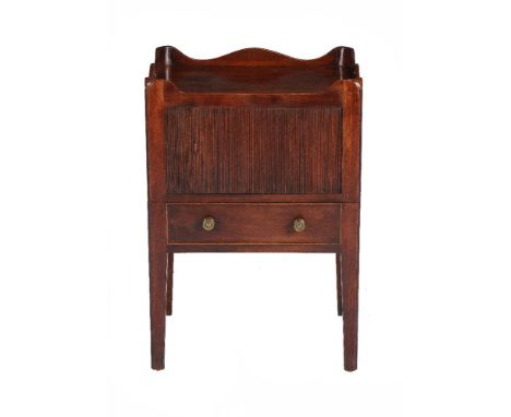 A George III mahogany night commode, circa 1790, the tambour compartment above a slide with lidded compartment, 75cm high, 52