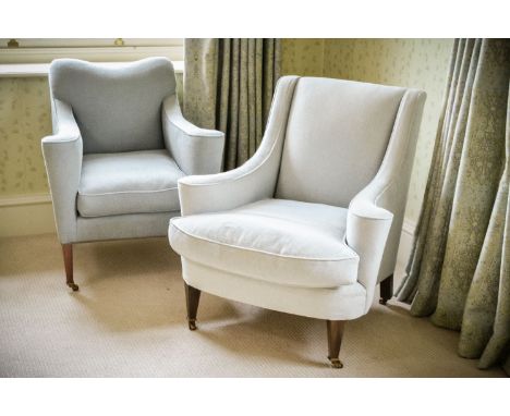 Two similar beech and upholstered armchairs, in early 20th century style, late 20th century, each with out-scrolling arms, a 