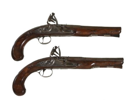 A pair of flintlock officer's pistols by BATE LONDON, circa 1775, the shell-carved walnut stocks with Wogdon style flat grips