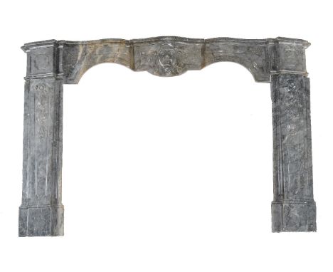 A French variegated grey marble chimneypiece in Louis XV style, late 19th century, the moulded serpentine mantel and frieze w