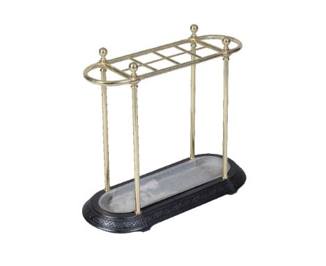 A late Victorian cast iron and brass mounted stick stand, circa 1890, the superstructure of rectangular form with looped ends