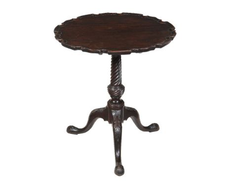 A George III carved mahogany tripod table, circa 1770, with 'piecrust' edge, 71cm high, the top 65cm diameter   Provenance: P