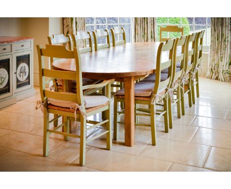 A large burr elm refectory table, late 20th century, 76cm high, 124cm wide, 300cm long, together with a set of twelve green p