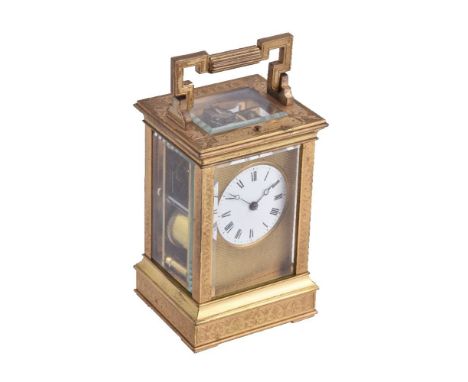 A French gilt brass carriage clock, late 19th century, the eight-day gong striking movement with push button repeat, the circ