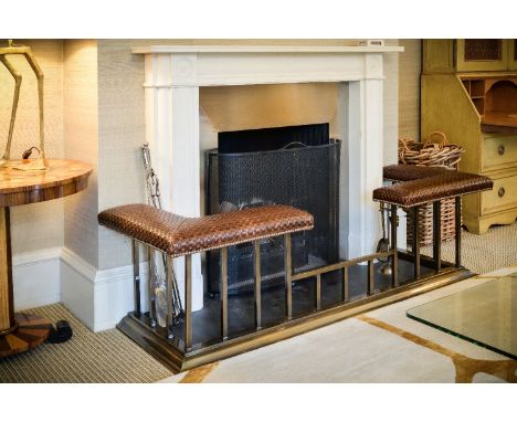 A club fender, of recent manufacture, the woven leather seats above lacquered metal square section uprights and moulded base,